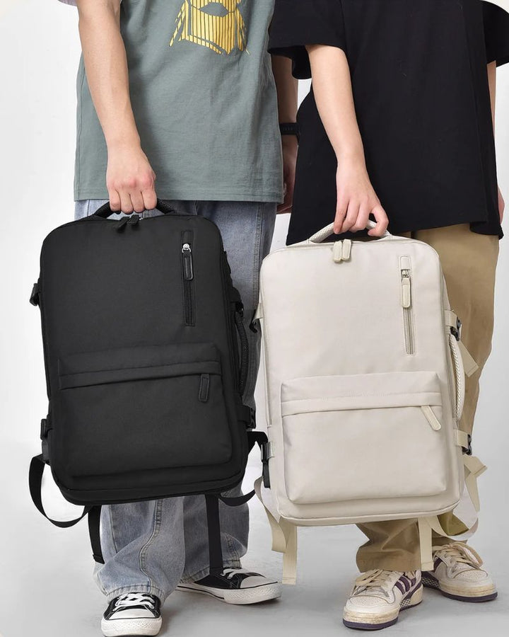 Sac à dos cabine extensible, porté à la main, coloris crème et noir