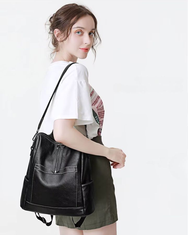 Sac à dos bandoulière cuir femme, porté sur l'épaule